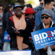 People wait to attend a campaign rally for Democratic presidential candidate former Vice President Joe Biden on Tuesday, March 3, 2020, in Los Angeles.